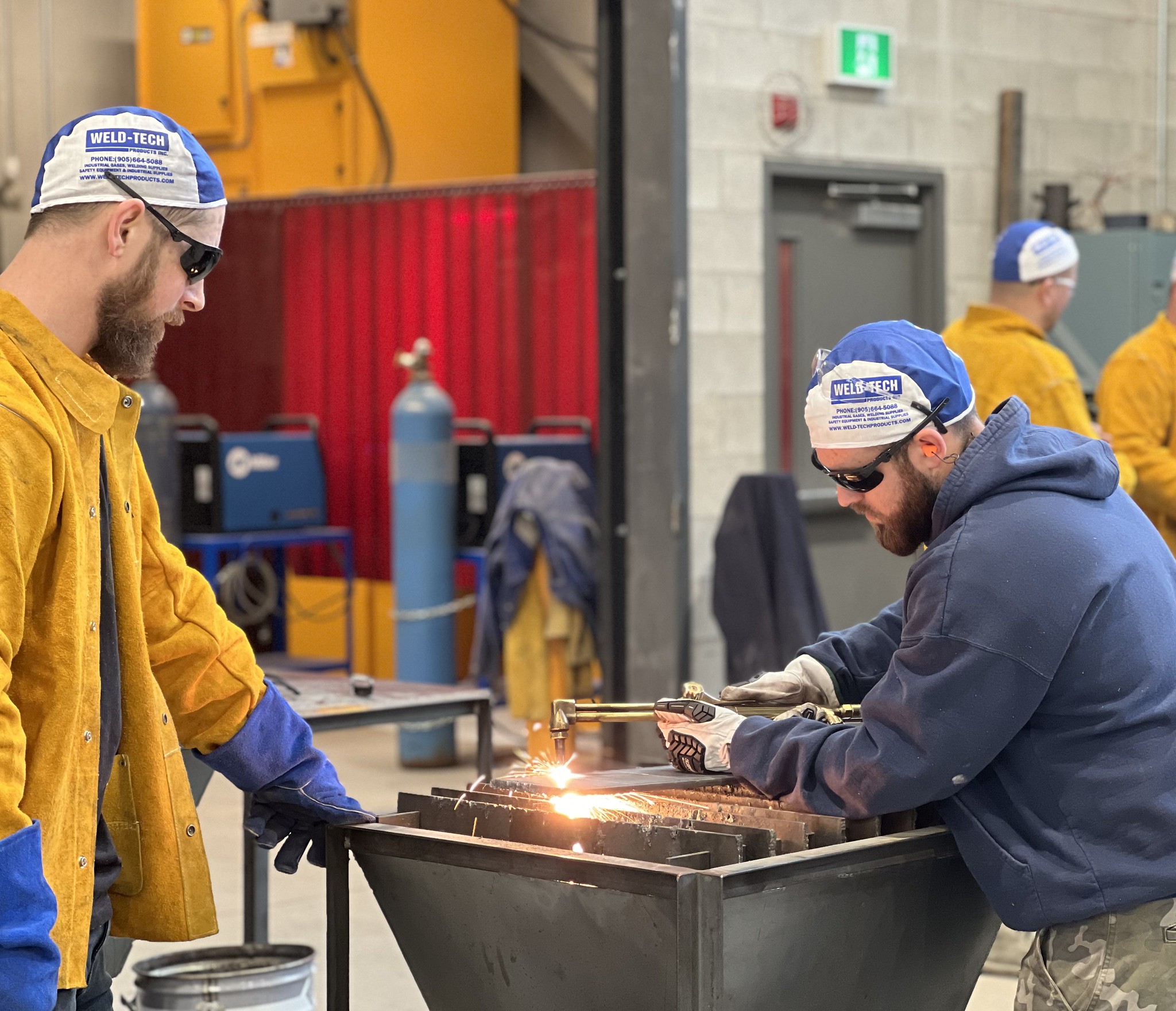 Two men welding