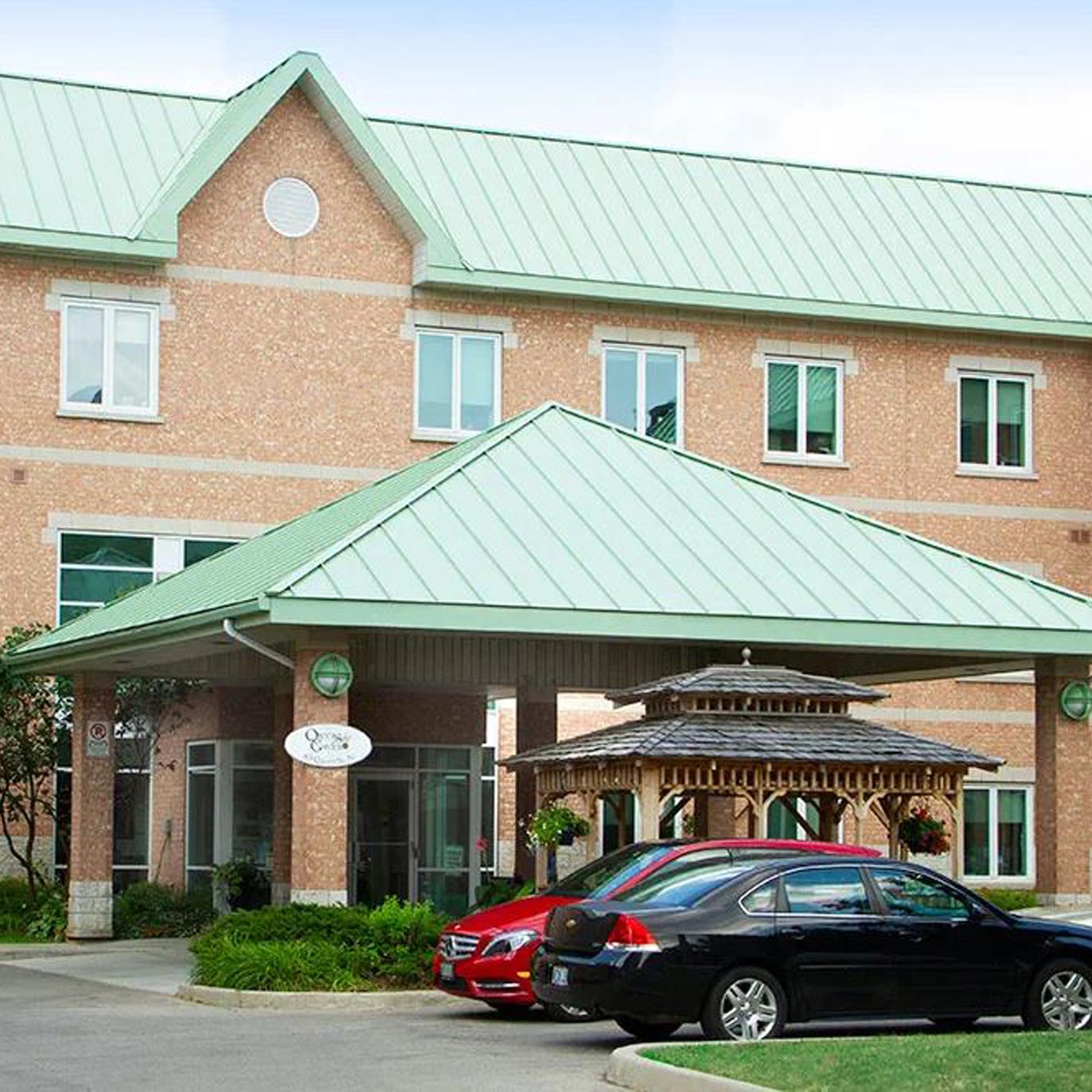 A large building with a green tin roof